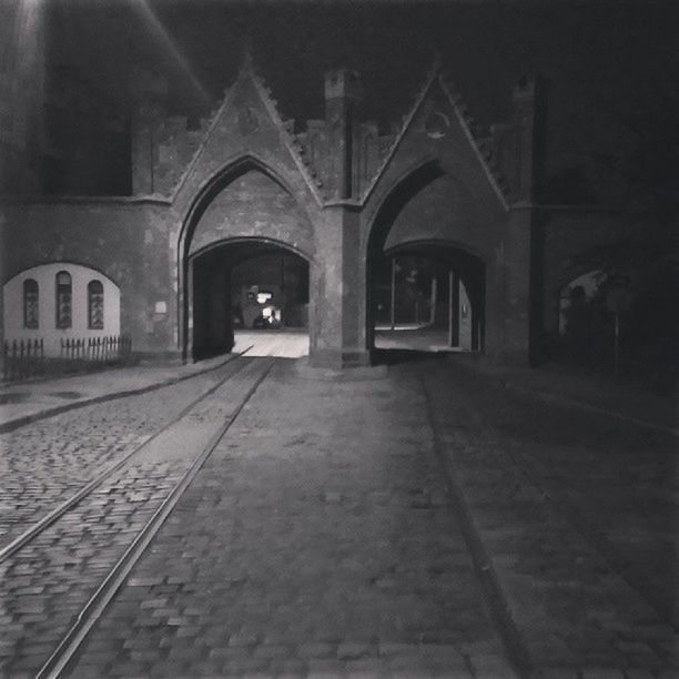 architecture, built structure, the way forward, arch, building exterior, diminishing perspective, empty, church, cobblestone, religion, street, vanishing point, no people, building, night, walkway, illuminated, surface level