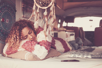 Woman sleeping in van