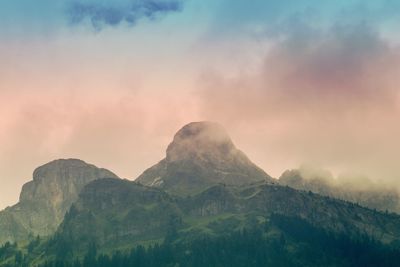 Scenic view of mountains against sky during sunset