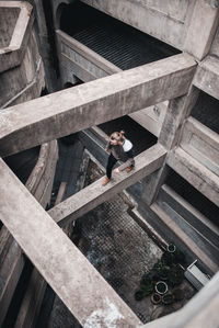 High angle view of man walking on abandoned building