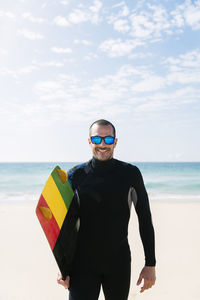Portrait of man standing on beach