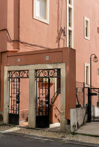 An old pink building in the historic center of a portuguese city coimbra