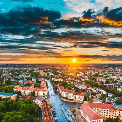 High angle view of buildings against sky during sunset