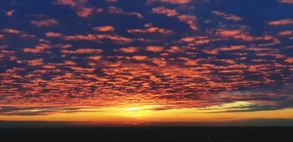 Scenic view of dramatic sky during sunset