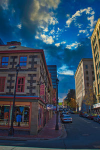 Street amidst buildings against sky in city