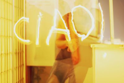 View of woman in dark room