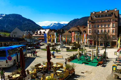 Buildings and mountains against sky