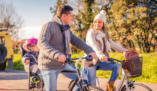 People riding bicycles on road