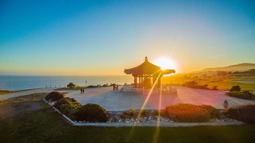 Scenic view of sea against clear sky during sunset