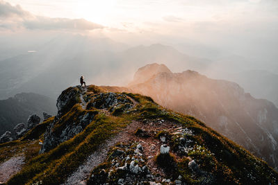 Rear view of man standing on mountain