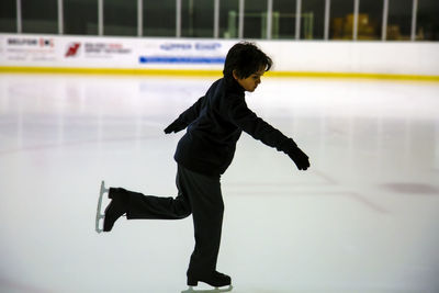 Low angle view of teenager doing skating