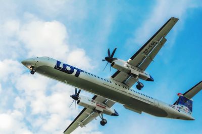 Low angle view of airplane against sky