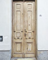 Closed wooden door of building