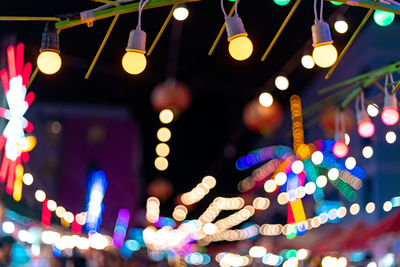 Low angle view of illuminated christmas lights hanging from ceiling