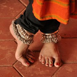 Low section of woman dancing on floor