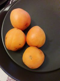 High angle view of oranges in bowl on table