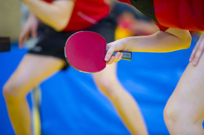 Players playing tennis in court