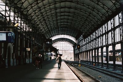 People waiting at railroad station platform