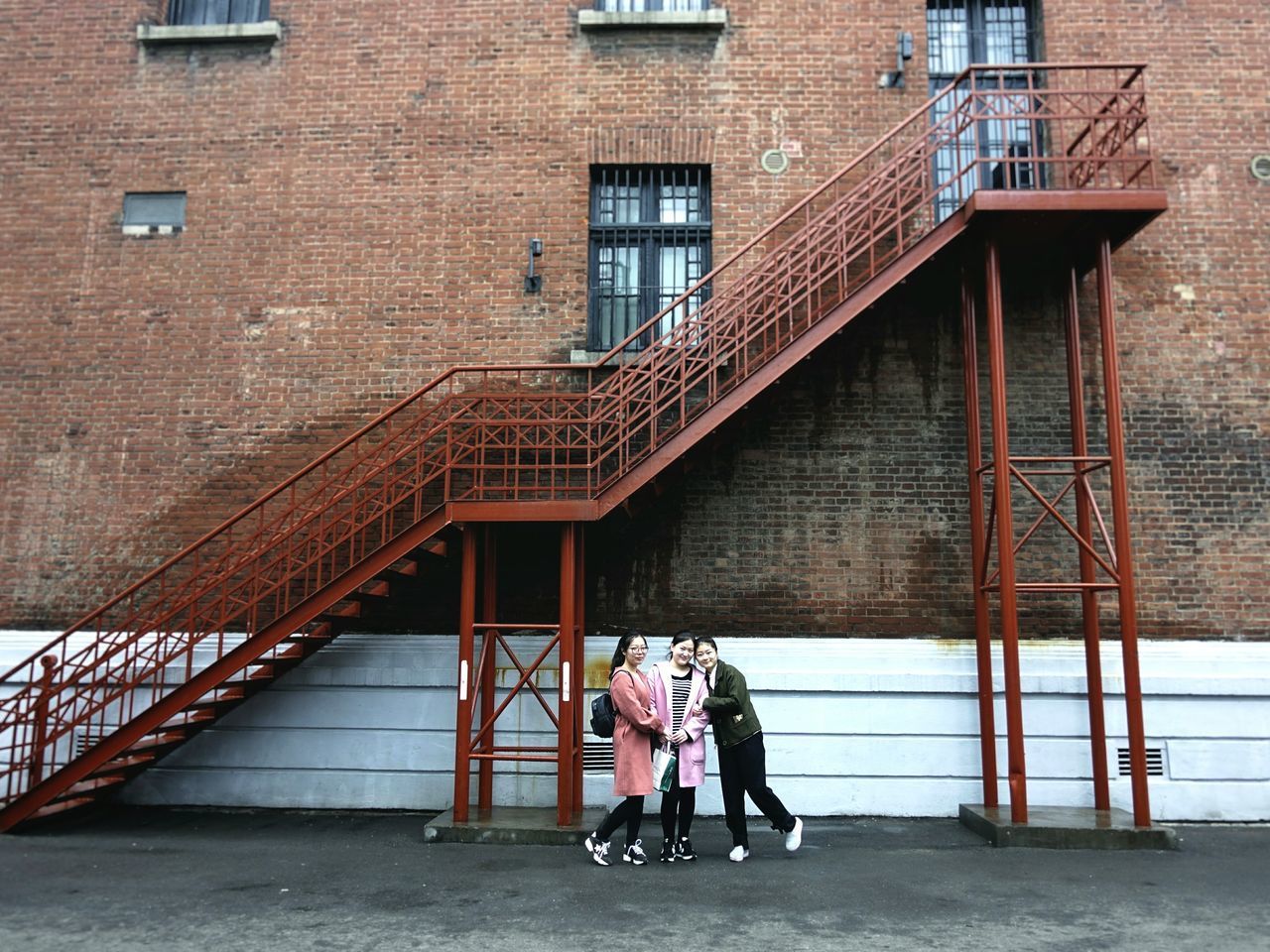 PEOPLE WALKING ON BRIDGE