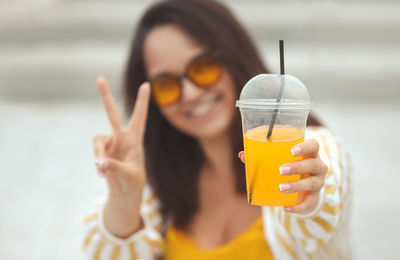 Close-up of woman holding drink