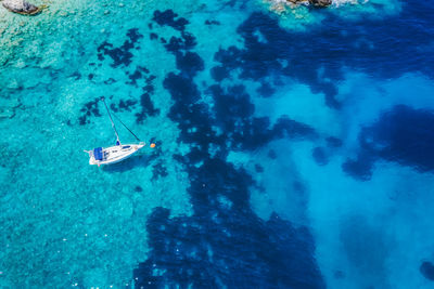 High angle view of rocks in sea