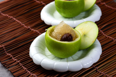 Close-up of fruits in plate on table