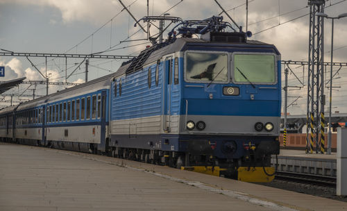 Train on railroad track against sky