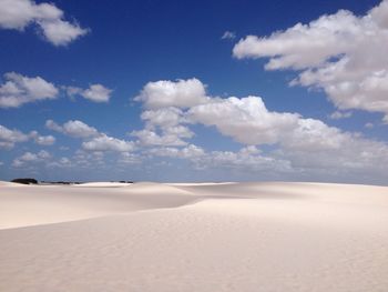 View of calm blue sea against clouds