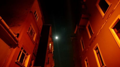 Low angle view of illuminated buildings at night
