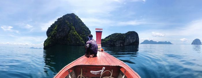 Boat sailing in sea against sky