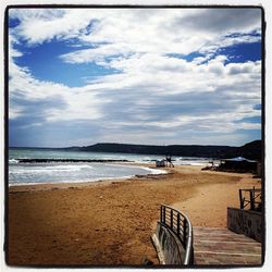 Scenic view of sea against cloudy sky