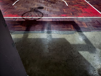 High angle view of man on wet floor in city