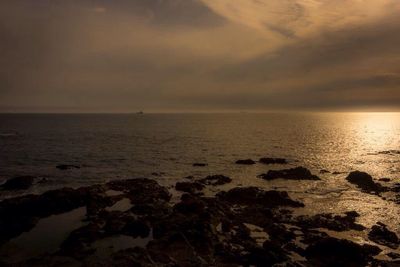 Scenic view of sea at sunset