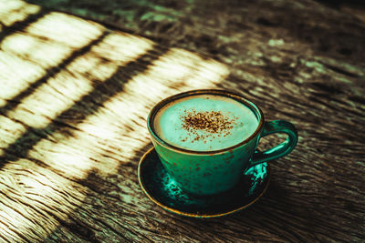 High angle view of coffee cup on table