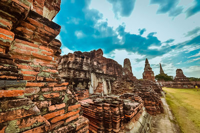 Ruins of temple against cloudy sky