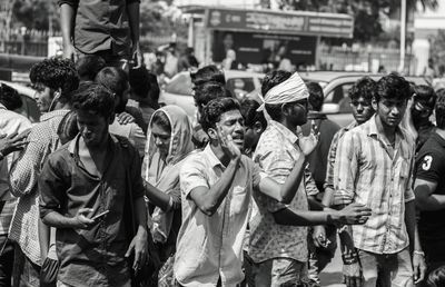 Crowd on street in city