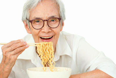 Portrait of young man drinking coffee at home