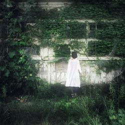 Woman standing on grass