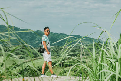 Full length portrait of man standing on land