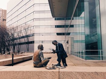 Full length of woman standing in city