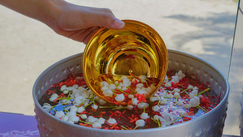 High angle view of person holding glass bowl