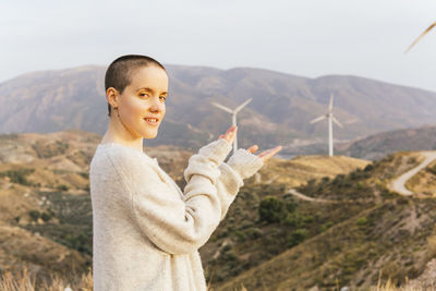 Portrait of smiling girl standing on mountain