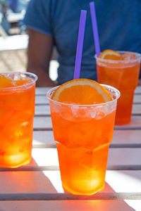 Close-up of orange juice on table