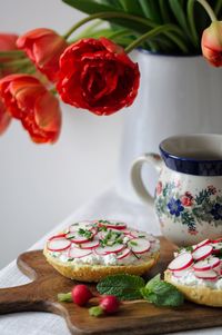 Close-up of food on table by flowers