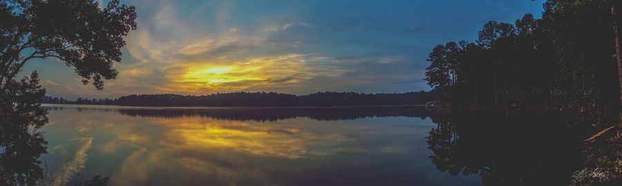 Scenic view of lake against sky during sunset