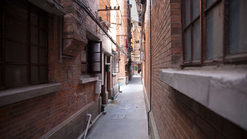 Alley amidst buildings in city