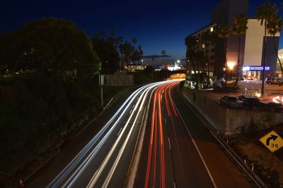 High angle view of light trails on road in city