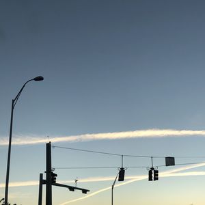 Low angle view of street light against sky