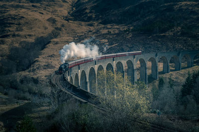 Scenic view of arch bridge over mountains