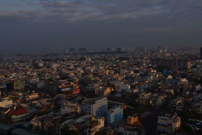 High angle view of illuminated buildings against sky in city